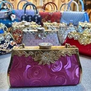 Luxurious Gold and Pink Floral Clutch with Crossbody chain strap.